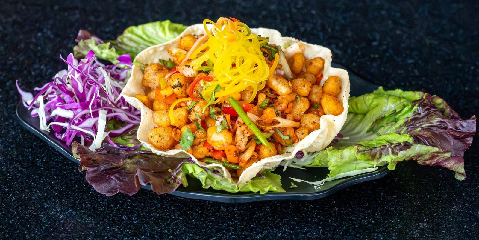 A crisp basket filled with a fried snack