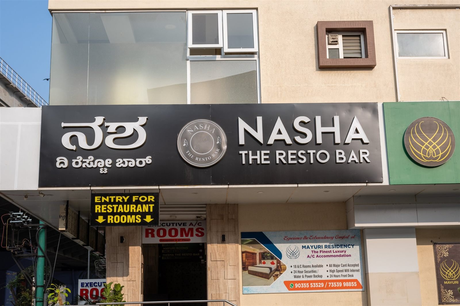 The Nasha The Resto Bar sign above the entrance on the street