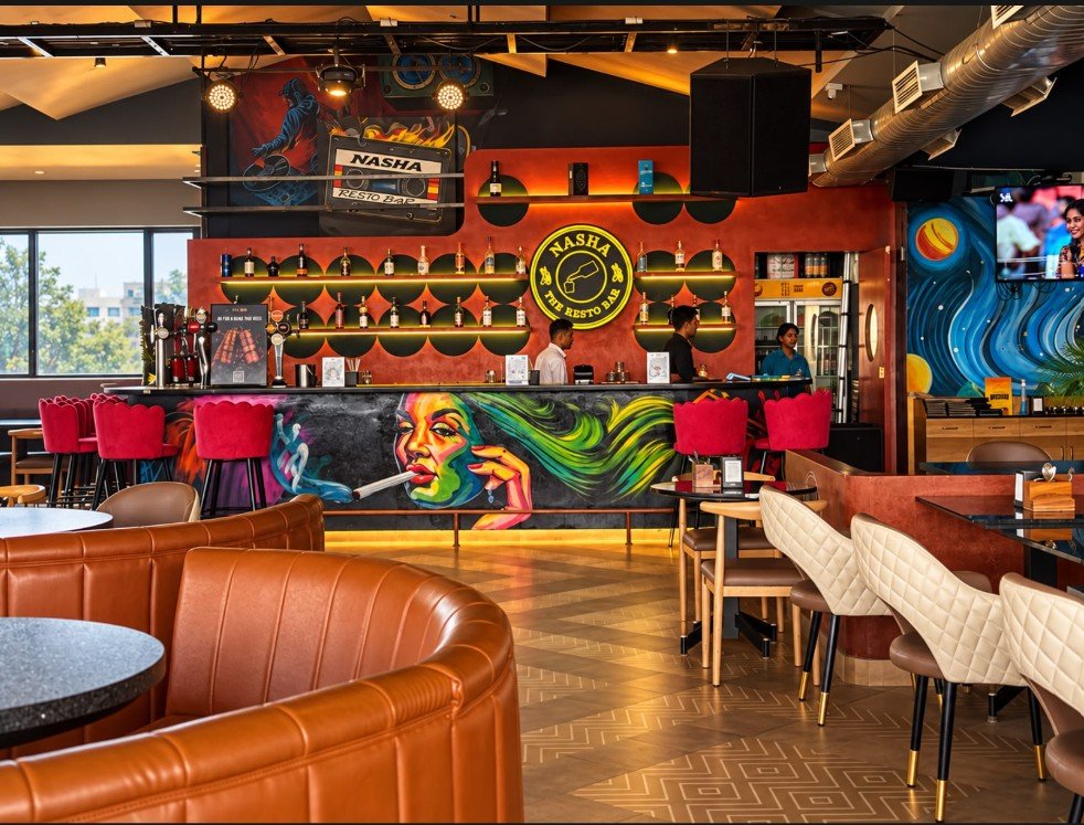 The Nasha bar, with bottles on shelves against a red wall and the Nasha sign